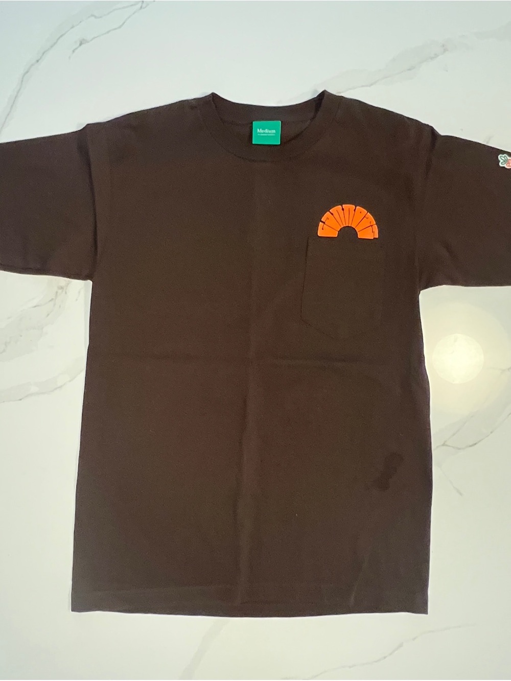 Carrots By Anwar - Brown Pocket Tee with Orange Carrots Graphic